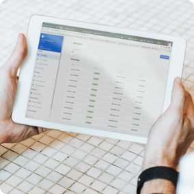 Person writing notes at laptop